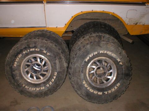 1978 Ford Bronco - Four Mud King XT steel radial tires are shown next to a vehicle, with the registry claiming it is a 1978 Ford Bronco.