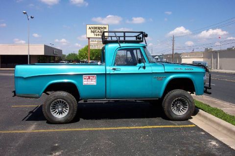 1992 Ford Bronco - A turquoise pickup truck is parked on asphalt with a "For Sale" sign on its side.