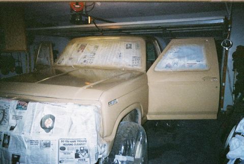 1983 Ford Bronco - Ford Bronco in garage, masked with newspaper for paint job preparation.