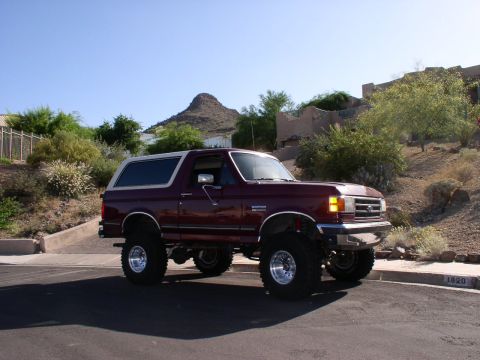1990 Ford Bronco - This lifted 1990 Ford Bronco is shown with large tires and chrome wheels.