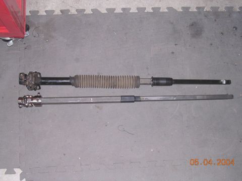 1994 Ford Bronco - old shaft with rubber rag joint next to new shaft with Flaming river ujoint