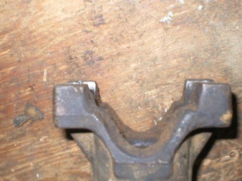 1978 Ford Bronco - This is a close-up view of a driveshaft yoke, a component of a vehicle's drivetrain.