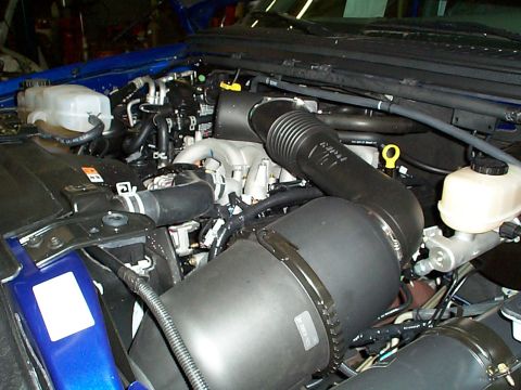 1978 Ford Bronco - Close-up view of a vehicle's engine bay, showing the air intake system and other components.