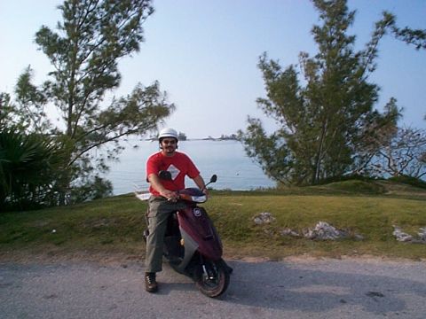 1994 Ford Bronco - Man on a scooter enjoys a scenic view of the coast.