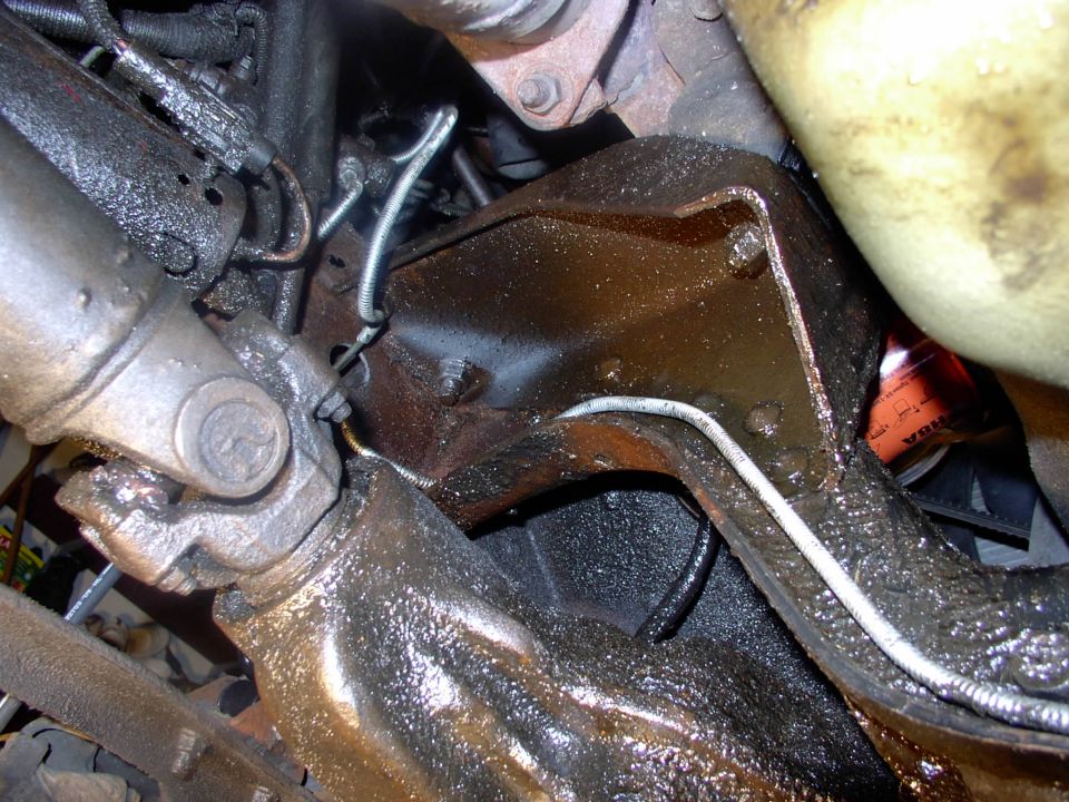 There's the other new brake line running from the right caliper, hugging the TTB and into that union block you can see just ahead of and over the fuel pump.