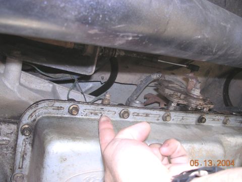 1994 Ford Bronco - this is where I put the tranny temp sender for the pillar gauge. this is a pressure port on the E40D. It prolly reads about 5 to 10 degrees…