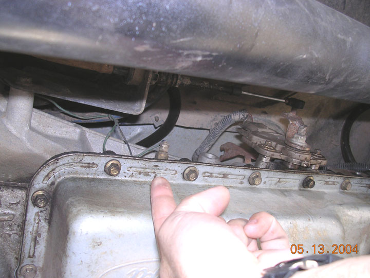 this is where I put the tranny temp sender for the pillar gauge.  this is a pressure port on the E40D.  It prolly reads about 5 to 10 degrees hot from the radiant heat, but gives me a good idea.  The cooler fan is switched at 160 IIRC, and it is pretty close to the temp readings I get.