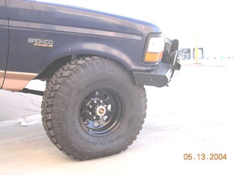 1994 Ford Bronco - since I put the heims in, I still need to adjust it some, as this tire is hitting a lot on the bumper, even after the trimming I did. So I…