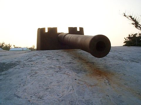 1994 Ford Bronco - A historic cannon is positioned on a stone fortification overlooking a coastal area.