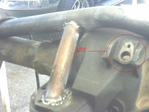 1995 Ford Bronco - Close-up view of a rear axle differential housing, highlighting the ABS sensor mount.