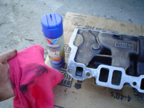 1981 Ford Bronco - cleaning off the remaining crap with carb cleaner and a clean rag.