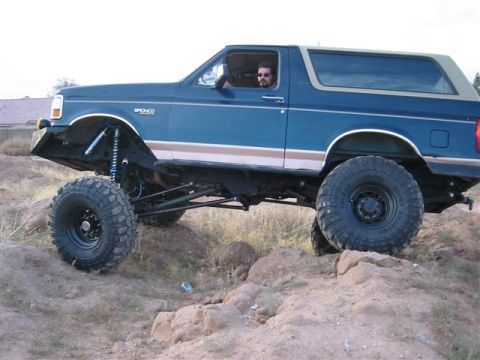 1994 Ford Bronco - Modified 1994 Ford Bronco navigating a rocky, off-road course.