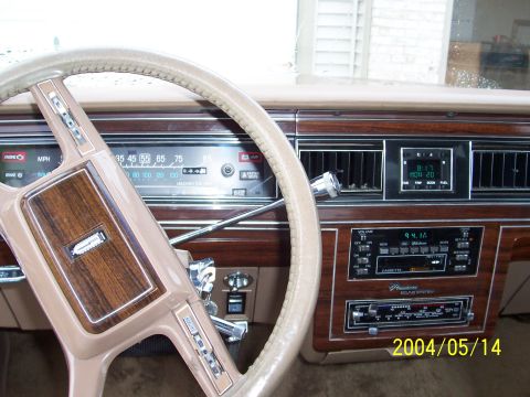1982 Ford Crown Victoria LTD - Interior view of a car dashboard, showing the steering wheel, instrument cluster, and radio.