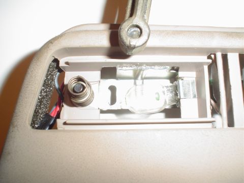 1993 Ford Taurus - The final step in attatching the cover is to screw it in.. through the light bezels.