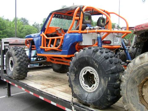 1995 Ford Bronco - This heavily modified buggy features a custom roll cage and oversized tires, suggesting it's built for extreme off-road use.