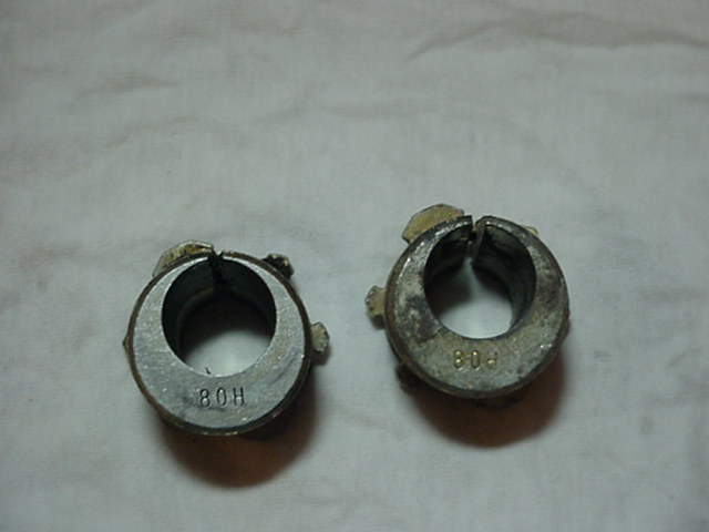 Two metal hose clamps with '80H' and '80-' markings