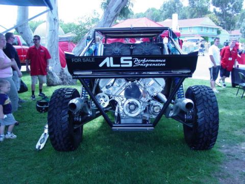 1992 Ford Bronco - A custom off-road buggy with a powerful engine is displayed for sale at an outdoor event.