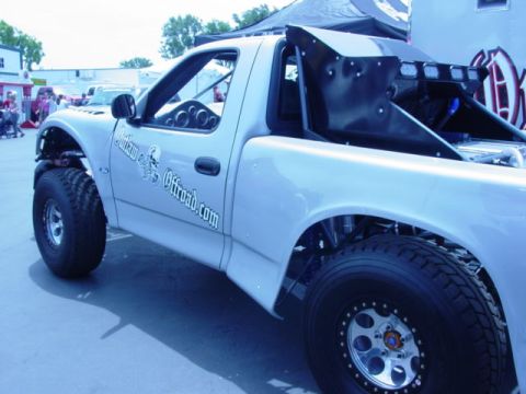 1992 Ford Bronco - Custom pickup truck with off-road modifications and a prominent rear spoiler.