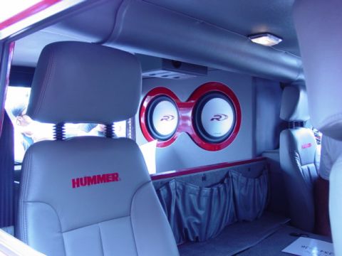 1992 Ford Bronco - The interior of a Hummer features custom audio equipment, including two large subwoofers.