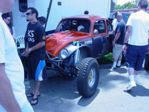 1992 Ford Bronco - Custom off-road buggy with a distinctive orange and black paint scheme and prominent suspension modifications.