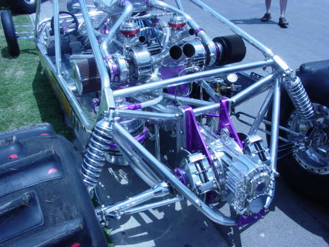 custom dragster with dual engines, chrome and purple accents, large rear tires