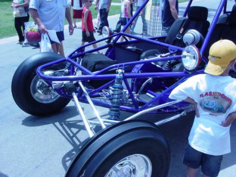 1992 Ford Bronco - A blue dune buggy is partially visible with a child standing nearby.