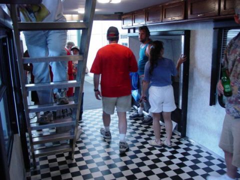 1992 Ford Bronco - People are seen inside a trailer with a checkered floor and a ladder.