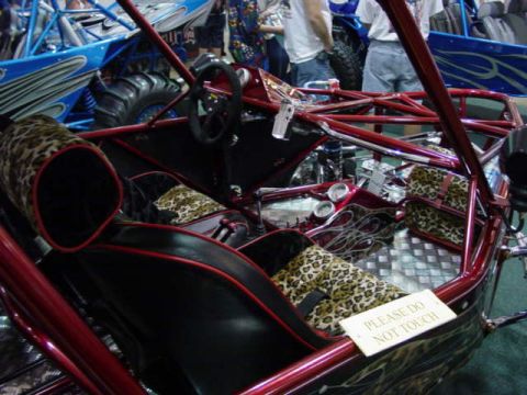 1992 Ford Bronco - Custom dune buggy interior with unique upholstery and a warning sign.