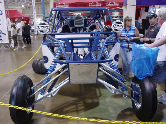 Blue off-road buggy front view with Hella lights