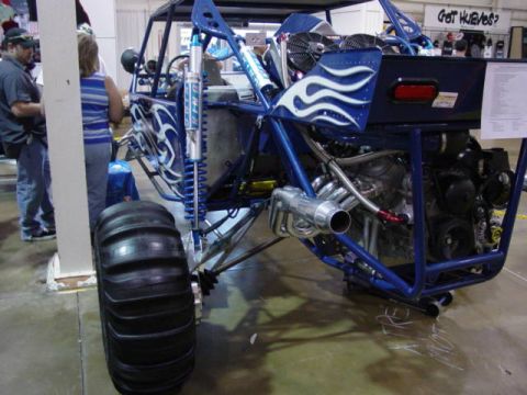 1992 Ford Bronco - Custom dune buggy on display, a prominent engine and large rear tires.
