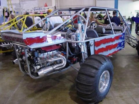 1992 Ford Bronco - This custom-built buggy features a powerful engine and patriotic paint scheme, likely displayed at an indoor event.