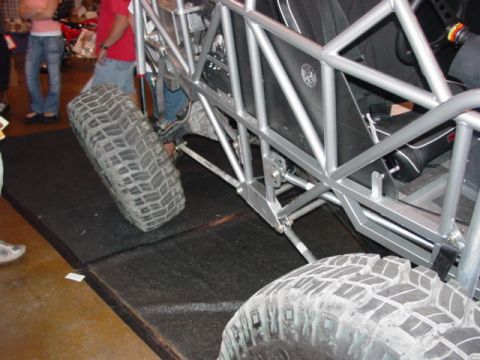 1992 Ford Bronco - Close-up of an off-road buggy's exposed chassis and aggressive tires.