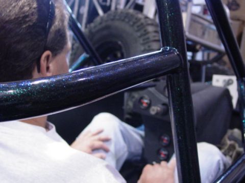1992 Ford Bronco - Interior view of a custom off-road vehicle with a roll cage and dashboard gauges visible.