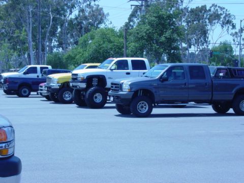 1992 Ford Bronco - a few trucks in the parking lot
