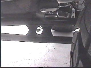 1993 Ford Bronco - Close-up view of the vehicle's frame and a tire, with SuperMotors branding at the bottom.