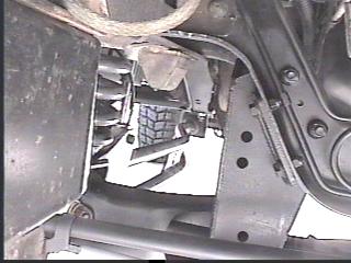 1993 Ford Bronco - Close-up view of vehicle undercarriage mechanical components and suspension system.