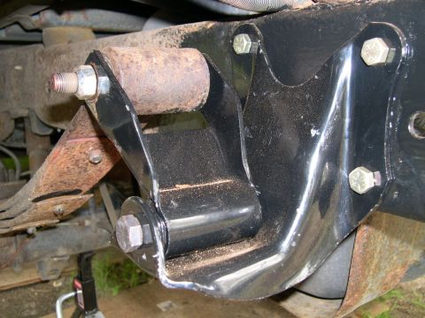 1994 Ford Bronco - Leaf spring shackle mount detail, showing rust and hardware.