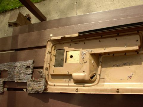 1986 Ford Bronco - Peel back the insulation away from the glue. Start bending straight all the tabs so you can start removing all the clips.