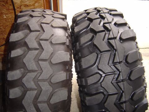 1978 Ford Bronco - Comparison of a worn off-road tire next to a new one, tread differences.