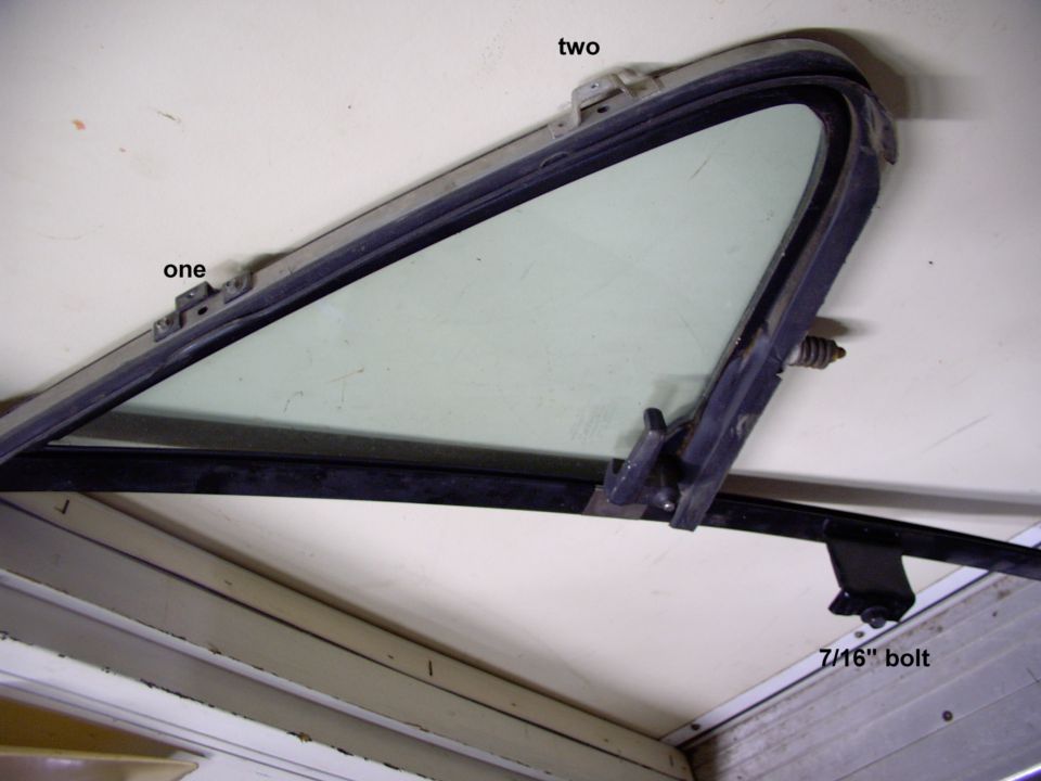 One and two note where the philips hold it on.  The 7/16" bolt is under the inner door trim panel. just be careful removing the up and down window seal.