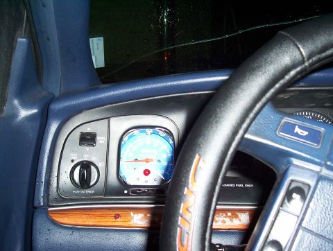 1995 Ford Crown Victoria - The interior of a 1995 Ford Crown Victoria features a blue dashboard and a clear view of the instrument cluster.