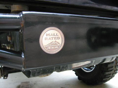 1985 Ford Bronco - Close-up of an aftermarket bumper with a 'Mall Rated 4x4' decal.