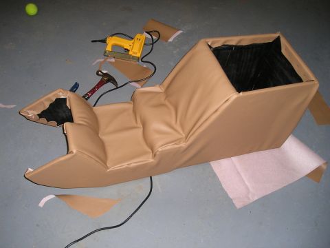 1996 Ford Bronco - Center console reupholstery in progress with tools laid out on the floor.