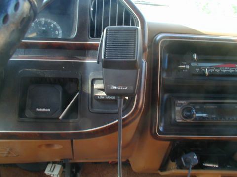 1988 Ford Bronco - Interior view of a truck's dashboard, showing a CB radio and stereo system.