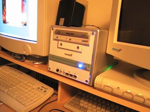 2000 Jeep Liberty - A computer setup two monitors, keyboards, and a desktop tower. A Ford logo is visible on the left monitor.