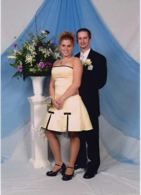 2000 Jeep Liberty - A couple poses for a formal portrait, with the woman in a strapless dress and the man in a suit.