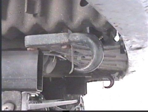 1993 Ford Bronco - Close-up of a tow hook assembly on a vehicle frame, with a watermark from Supermotors.net.