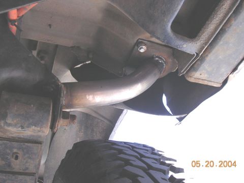 1994 Ford Bronco - Exhaust pipe modification with welded bracket, viewed from below. Date stamp reads 05.20.2004.