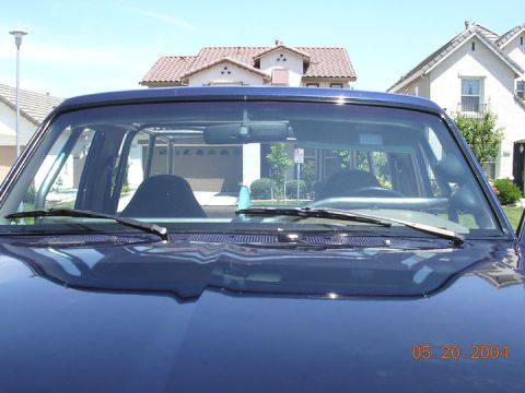 1994 Ford Bronco - The photo shows the interior of a blue SUV with a roll cage visible through the windshield. A date stamp reads 05.20.2004.