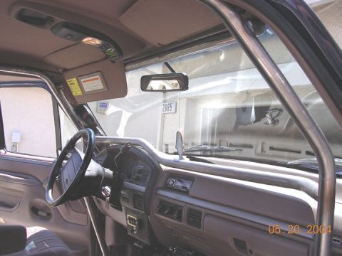 1994 Ford Bronco - Interior view of a 1994 Ford Bronco, a roll cage and dashboard with a date stamp of 05.20.2004.